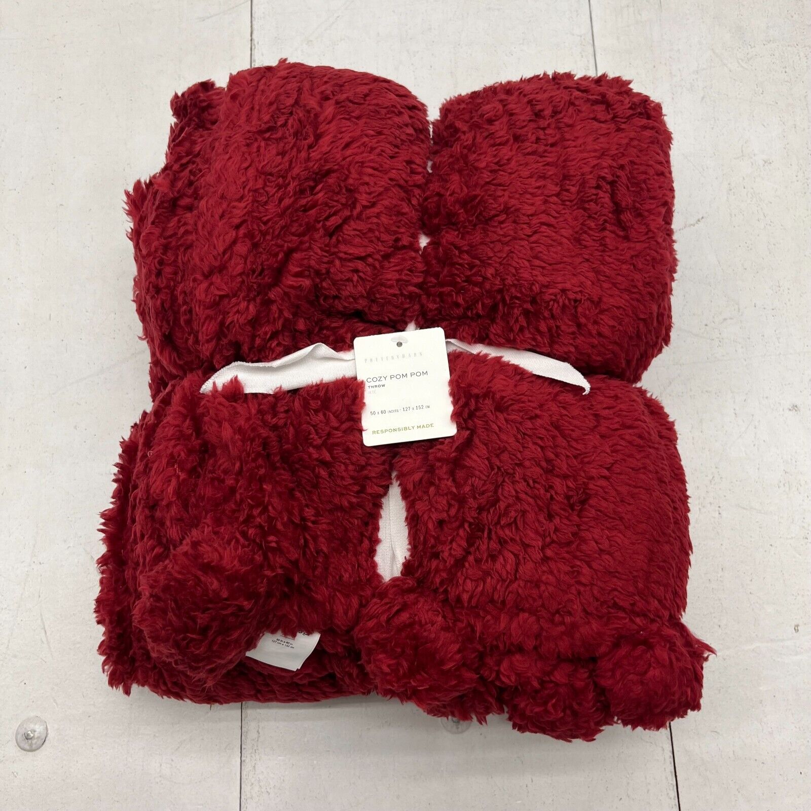 Pottery barn cozy pom pom throw hot sale